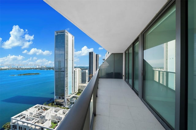 balcony featuring a view of city and a water view