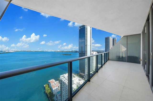 balcony with a city view and a water view