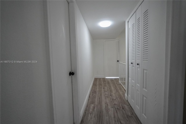 hallway with wood-type flooring