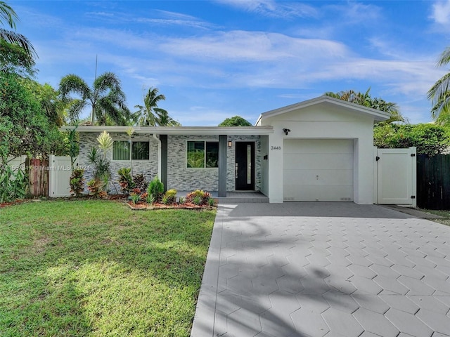 ranch-style home with a garage and a front lawn