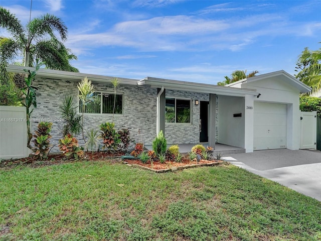 single story home with a garage and a front lawn