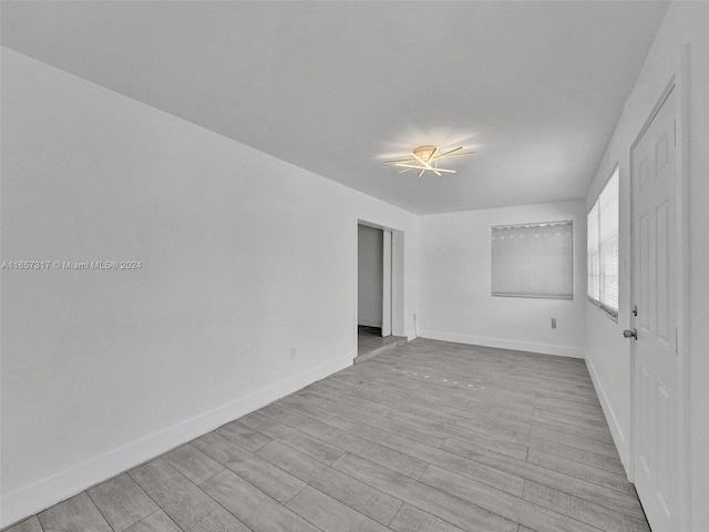 empty room with light wood-type flooring