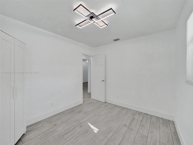 empty room with light wood-type flooring