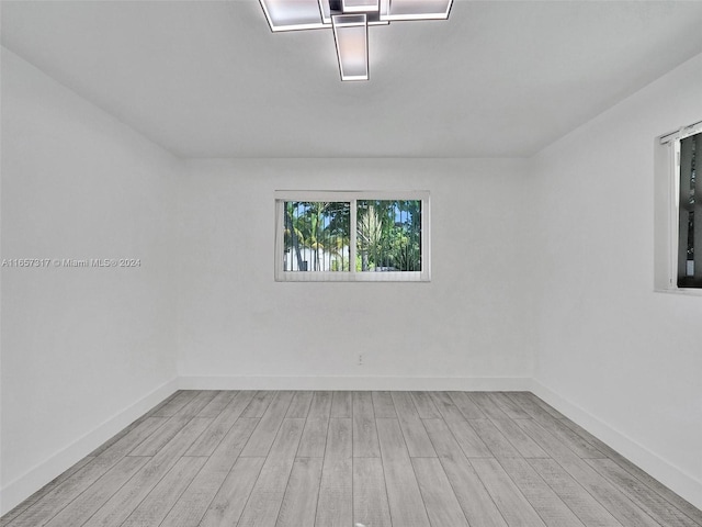 spare room featuring light hardwood / wood-style floors