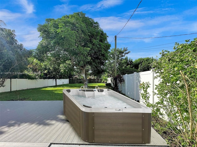 view of patio with a hot tub and a wooden deck