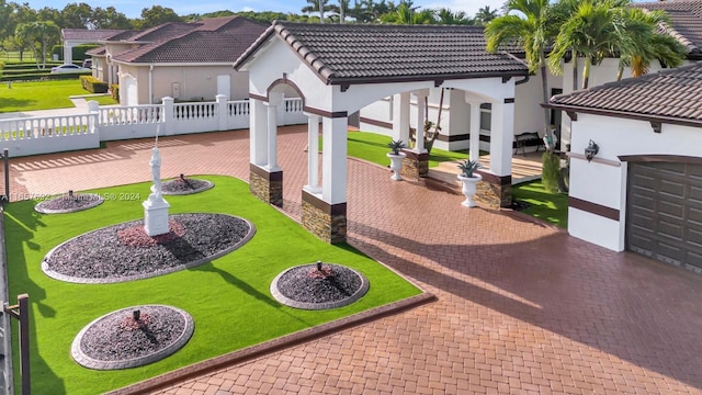 surrounding community with a lawn and a garage