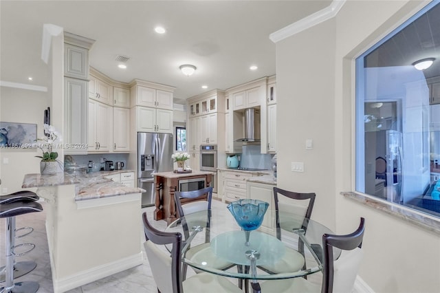 dining area featuring crown molding