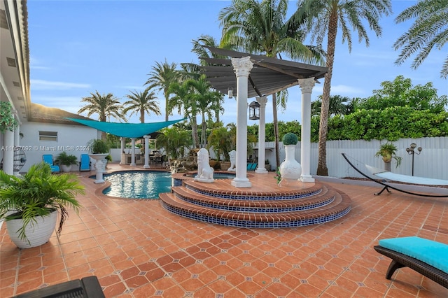 view of swimming pool with a patio and a pergola