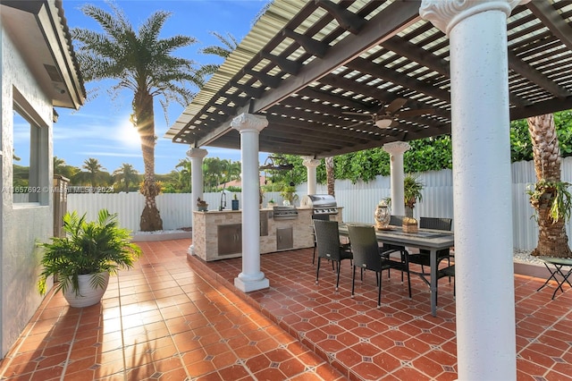 view of patio / terrace with a grill, an outdoor kitchen, and a pergola