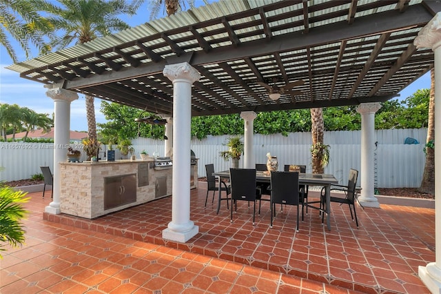 view of patio / terrace featuring a pergola and exterior kitchen