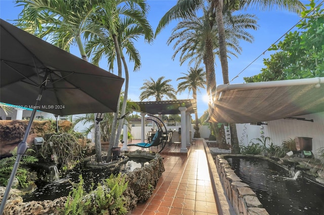 view of patio / terrace featuring a swimming pool