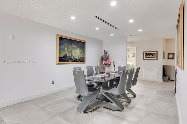 dining area with a textured ceiling