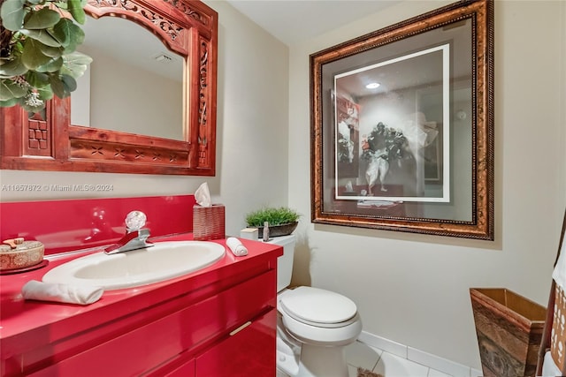 bathroom with vanity, toilet, and tile patterned flooring