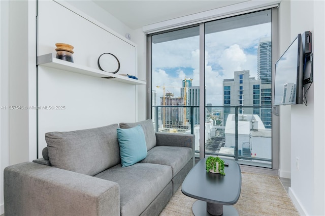 living room featuring plenty of natural light and floor to ceiling windows