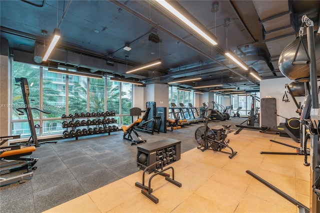 gym featuring floor to ceiling windows