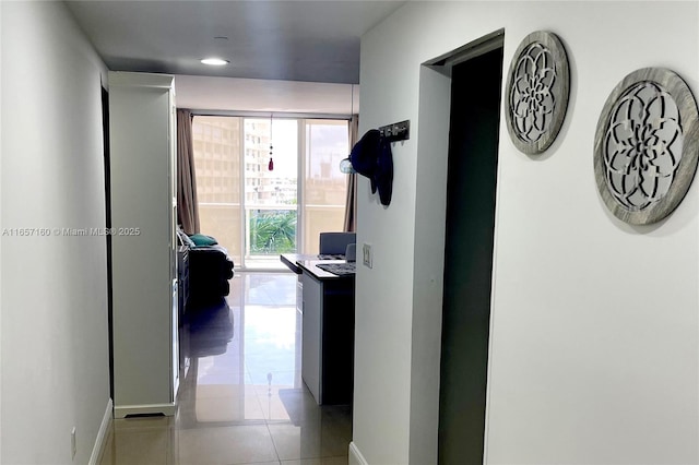 hall featuring light tile patterned floors