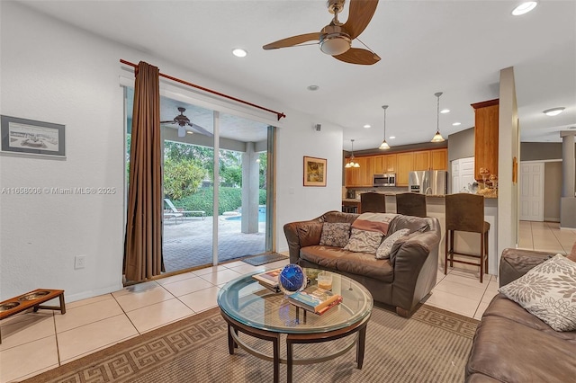 living area featuring light tile patterned floors, recessed lighting, and a ceiling fan