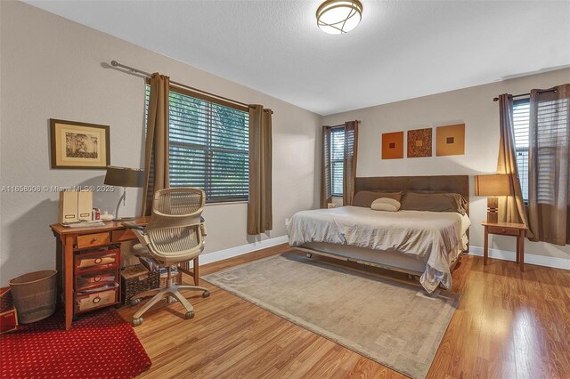 bedroom featuring hardwood / wood-style flooring