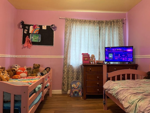 bedroom with wood-type flooring