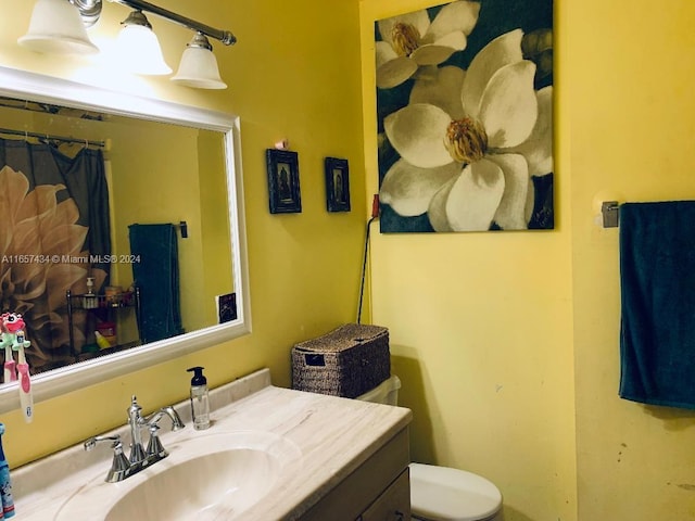 bathroom with vanity and toilet