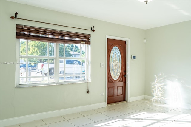 tiled entrance foyer featuring a wealth of natural light