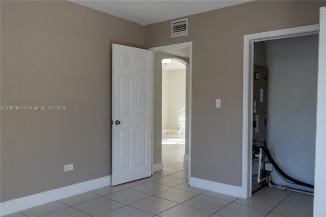 unfurnished bedroom with light tile patterned floors