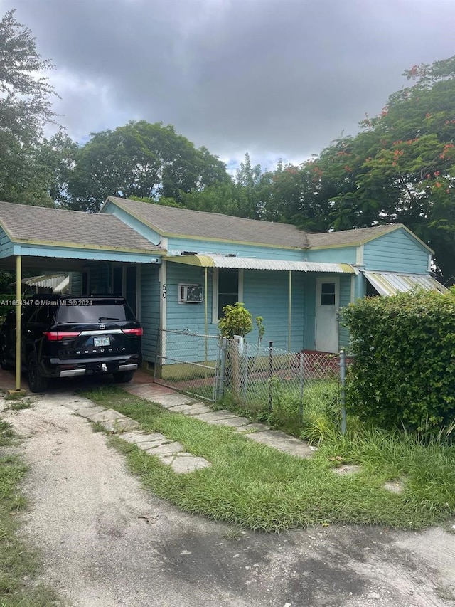 view of front of house with a carport