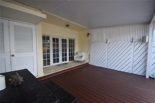 wooden deck featuring french doors