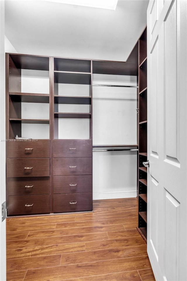 walk in closet featuring light wood-type flooring