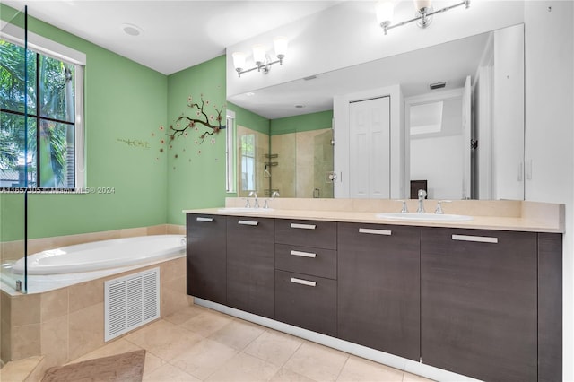 bathroom with vanity, tile patterned flooring, and separate shower and tub