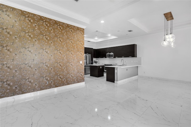 kitchen featuring pendant lighting, crown molding, appliances with stainless steel finishes, and sink