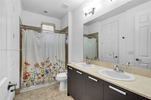 full bathroom featuring shower / bath combination with curtain, tile patterned floors, vanity, and toilet