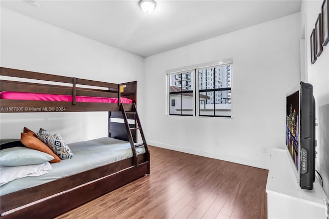 bedroom with hardwood / wood-style floors