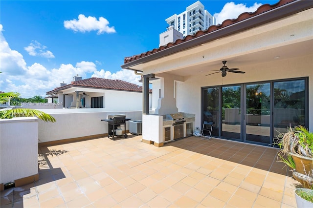 view of patio featuring central AC unit, area for grilling, and ceiling fan