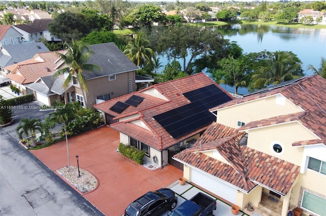 aerial view featuring a water view and a residential view