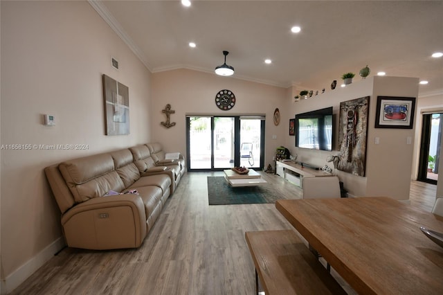 living room featuring crown molding, recessed lighting, and light wood-style floors