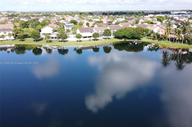 aerial view with a water view and a residential view