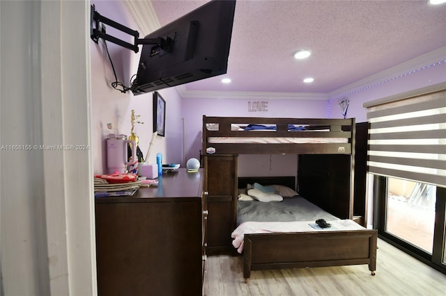 bedroom with recessed lighting, light wood-style flooring, crown molding, and a textured ceiling