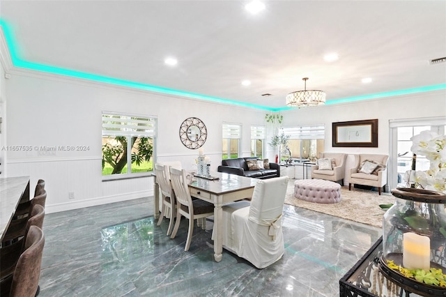 dining room featuring an inviting chandelier and crown molding