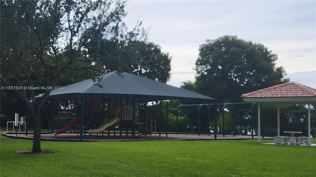 view of playground with a lawn