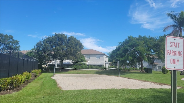 view of home's community with a yard and volleyball court