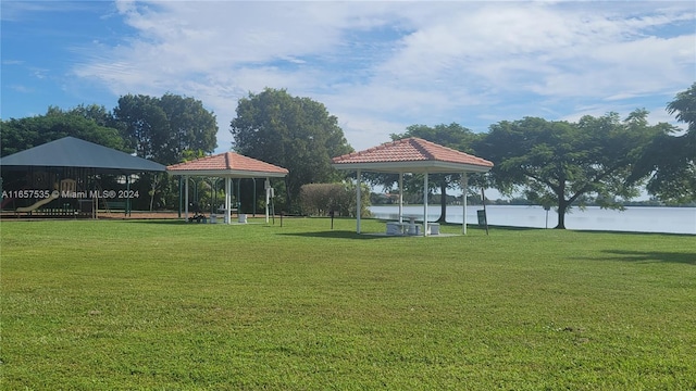 view of community featuring a gazebo, a yard, and a playground