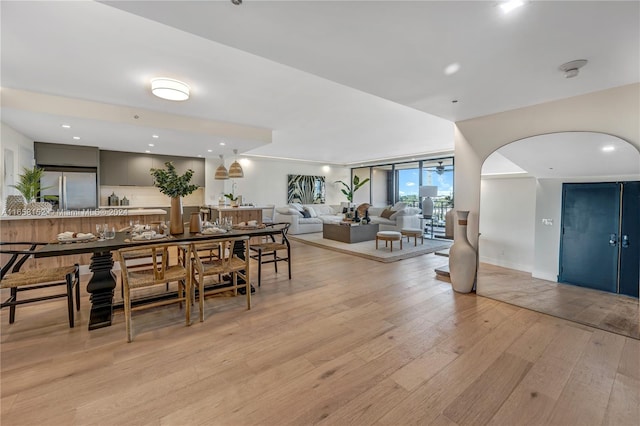 dining space with light hardwood / wood-style floors