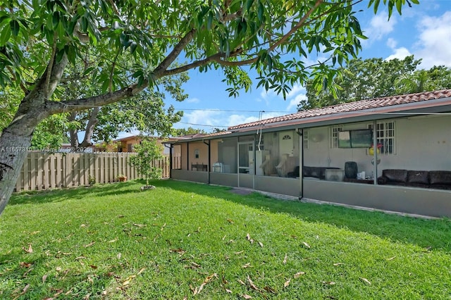 view of yard featuring a sunroom