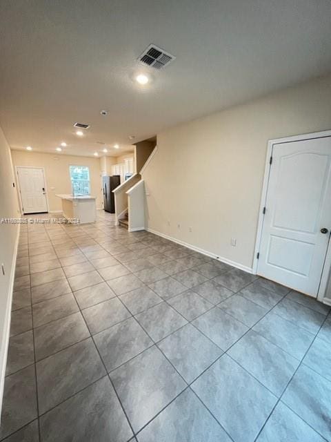 empty room featuring light tile patterned floors