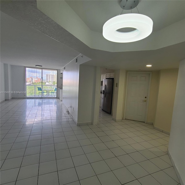 empty room with light tile patterned floors