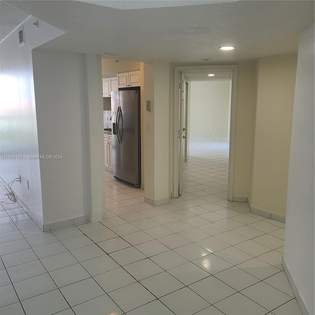 hallway with light tile patterned floors