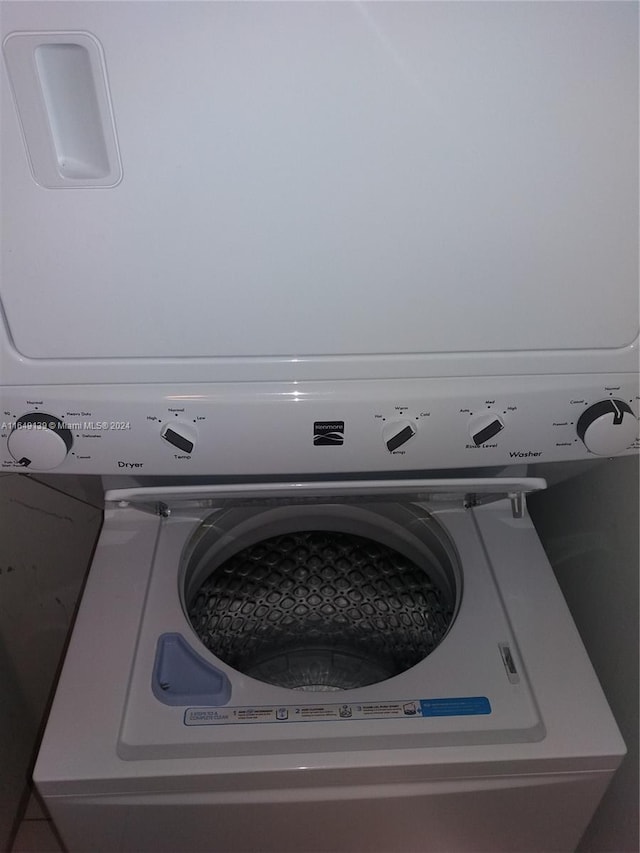 laundry room featuring stacked washer and dryer