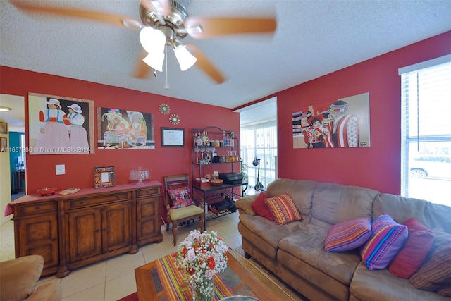 17560 Atlantic Blvd Unit 118, Sunny Isles Beach, FL 33160 - living area featuring ceiling fan, light tile patterned floors, and a textured ceiling