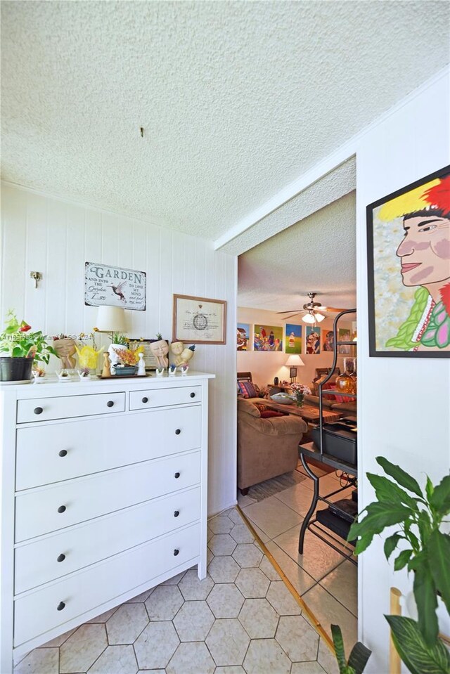 17560 Atlantic Blvd Unit 118, Sunny Isles Beach, FL 33160 - kitchen featuring a textured ceiling, light tile patterned flooring, and ceiling fan